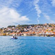 Boats riding by townscape of Lake Ohrid, North Macedonia